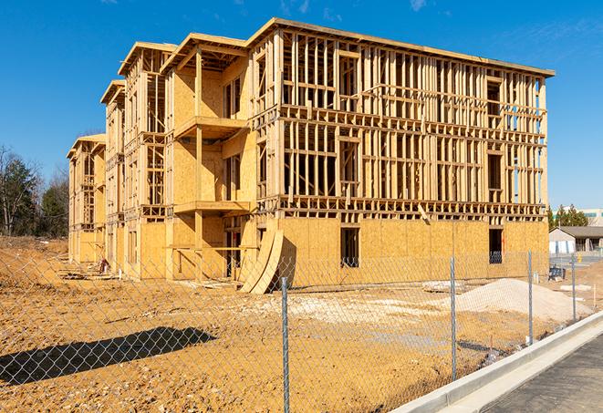 temporary fencing enclosing a construction site for privacy and protection in Farmington